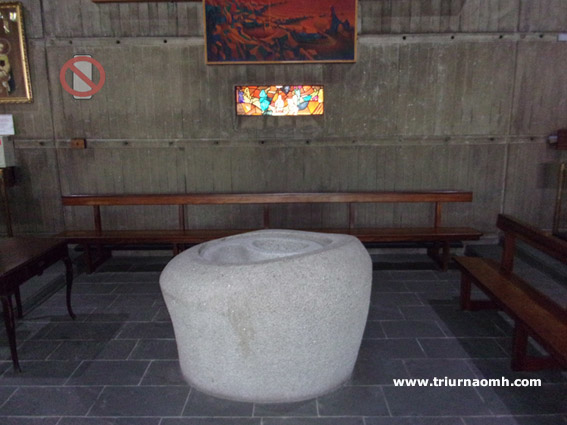 Baptismal font in stone at St Micheal's