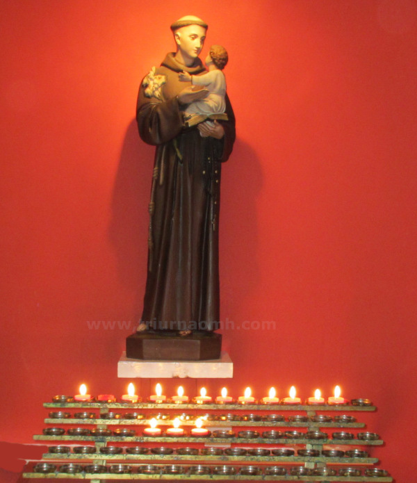 Votive candles Holy Family Parish church.