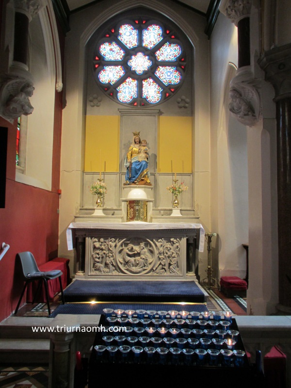 Side altar and votive candles in St Joseph's Glasthule.